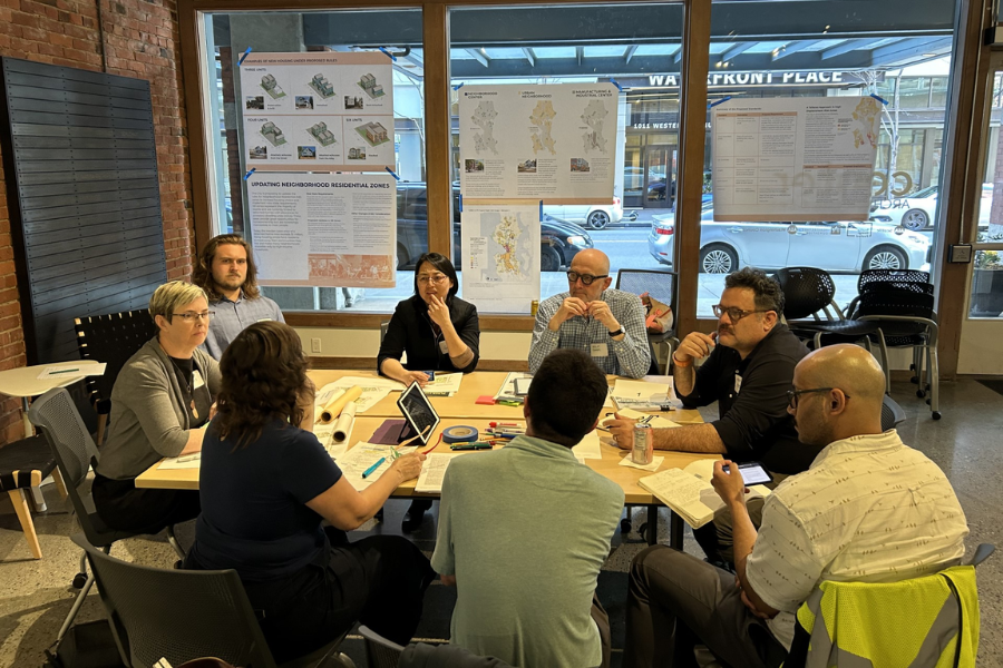 A group of people sitting around a table